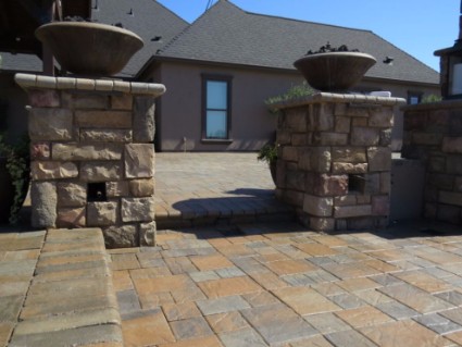 These are stacked stone pillars on stamped concrete patio in Folsom